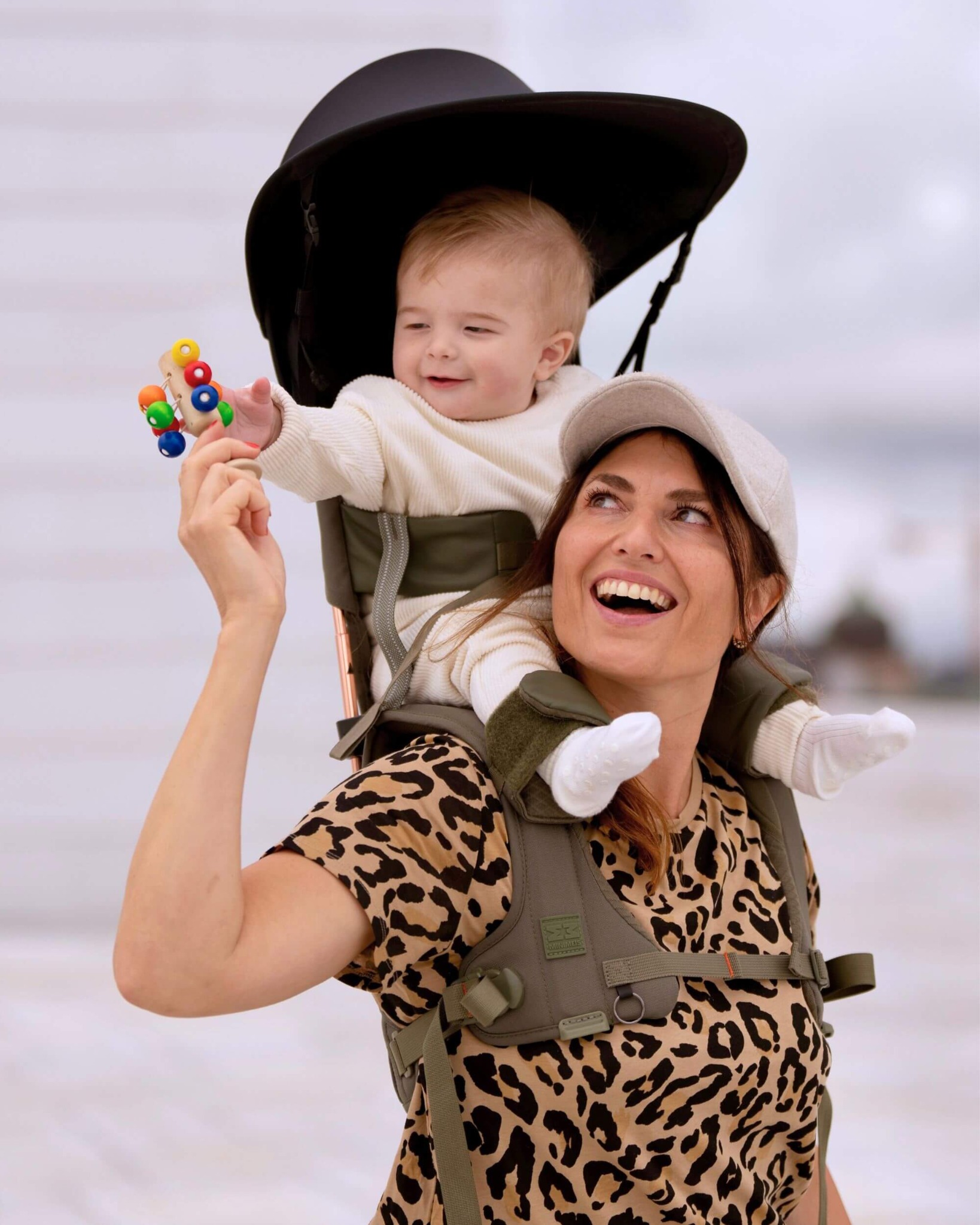 Child enjoying the elevated view from the shoulder carrier